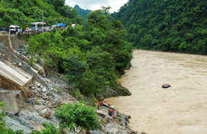 Nepal searches for people missing after landslides sweep two buses into river