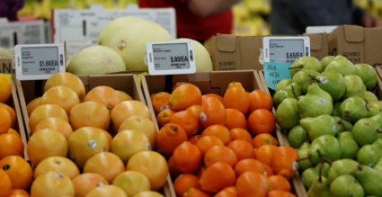 Prices are displayed on digital price tags at a 365 by Whole Foods Market grocery store ahead of its opening day in Los An...