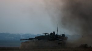 An Israeli tank manoeuvres, amid the Israel-Hamas conflict, near the Israel-Gaza border, in Israel