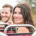 Woman smiling on board a Big Bus sightseeing tour