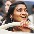 Woman smiling on board a Big Bus sightseeing tour