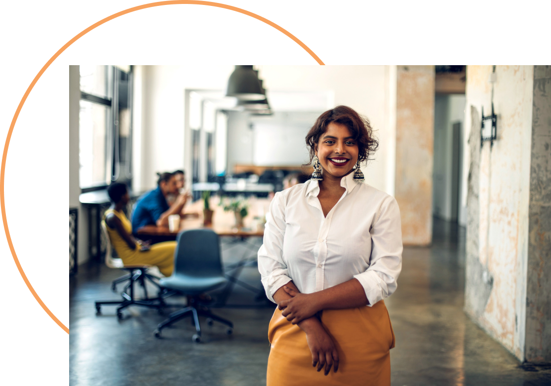 A lady standing in front of a meeting table