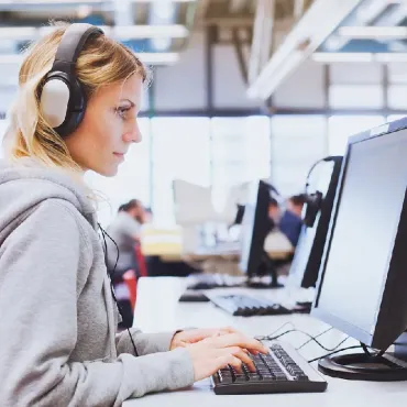 Woman using a computer looking right