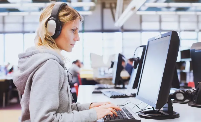 Woman using a computer looking right