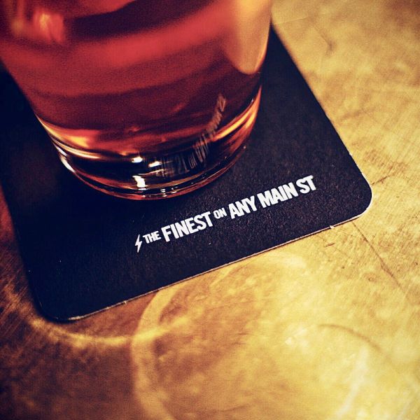 A Glass Of Wine Sitting On Top Of A Table