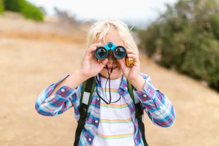 Cute kid with binoculars