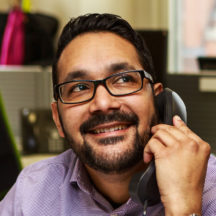 A man using a telephone.