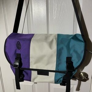 Timbuk2 Messenger Purple,white and blue with black strap and hardwares.