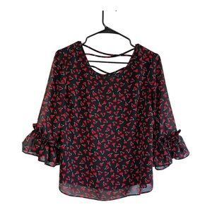 Sheer lined front cherry print 3/4 sleeve ruffled cuffs back criss cross detail