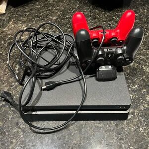 PS4, excellent condition. 2 controllers, charging station and cords.