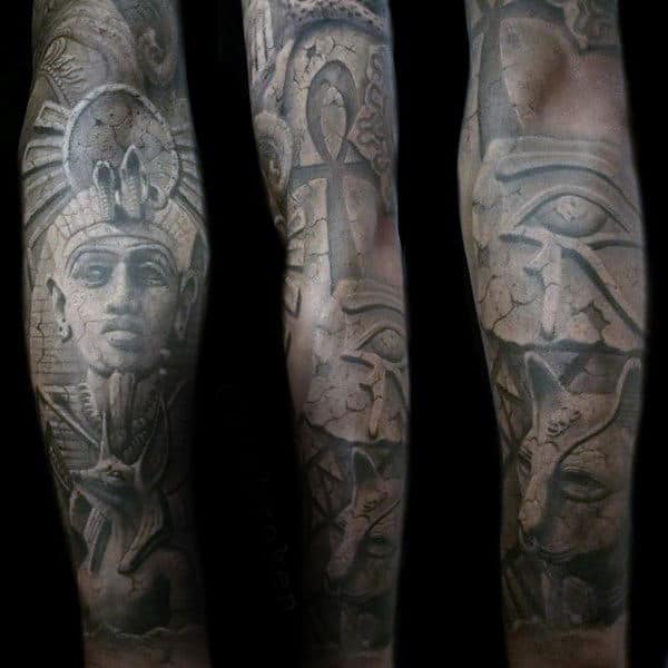 man with hieroglyphic ankh ancient egypt themed sleeve tattoo