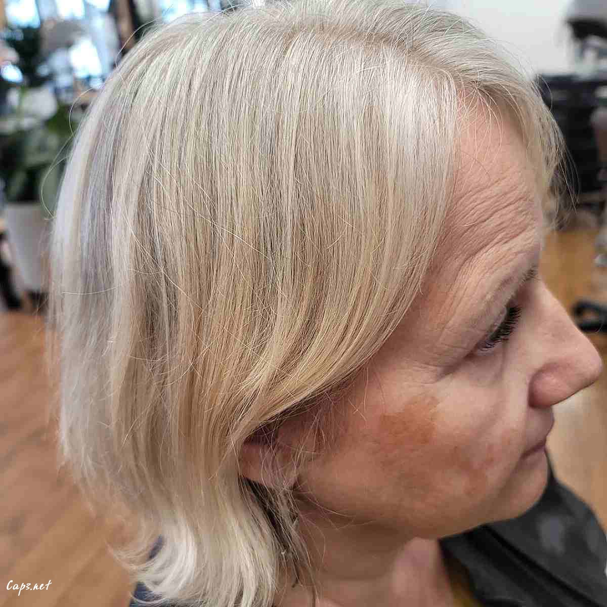 gorgeous grey bob with long side swept bangs for ladies over sixty