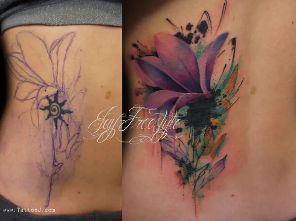 watercolor lower back cover up flower tattoo design