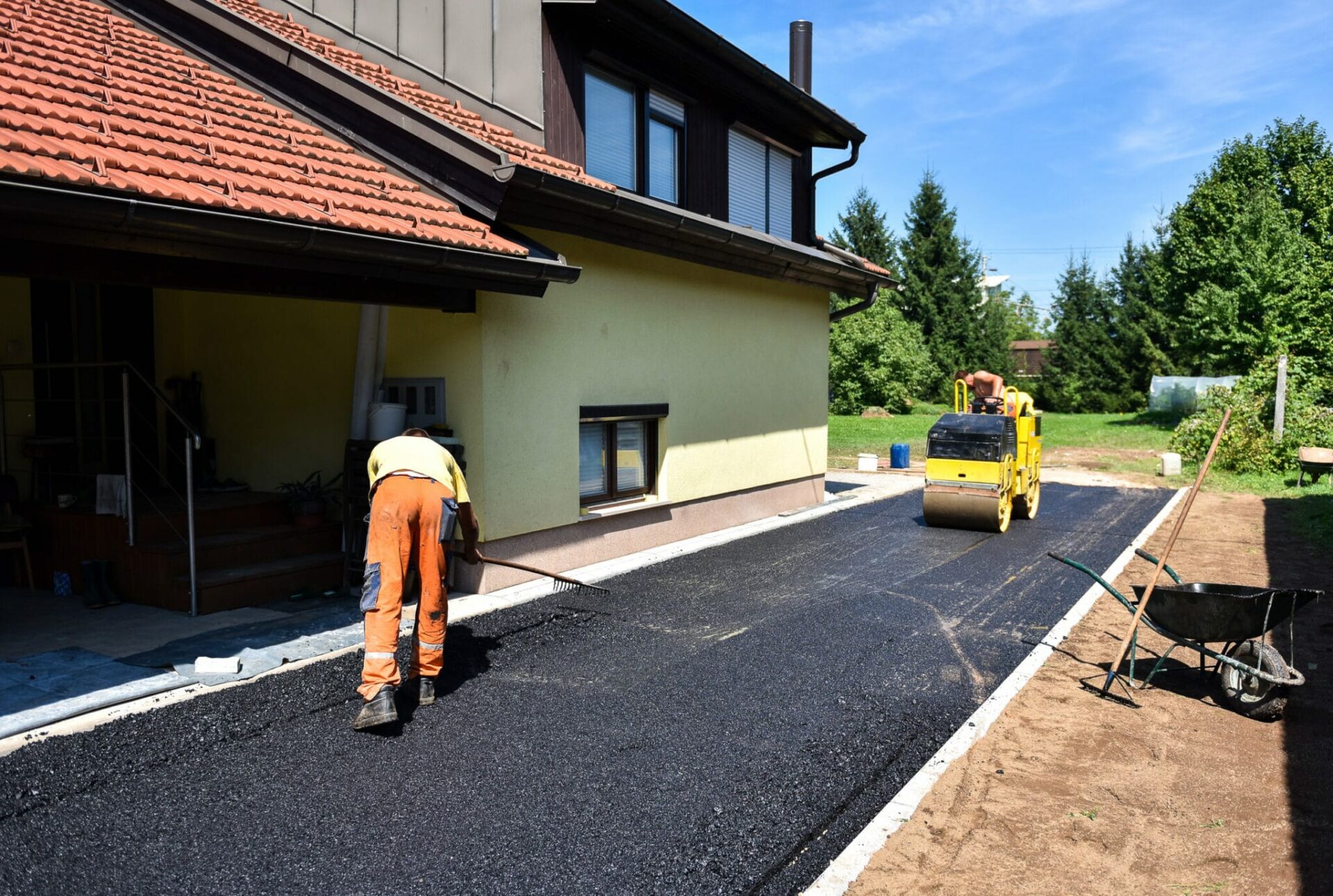 Team of Workers making and constructing asphalt road construction.