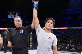 Takeru Uchida of Japan celebrates after his victory over Shaun Etchell of Australia in their flyweight bout during the Road to UFC event at Singapore Indoor