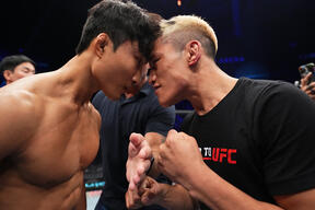 Finalists JeongYeong Lee of South Korea and Yi Zha of China face off during the Road to UFC event at Etihad Arena on October 23, 2022 in Abu Dhabi, United Arab Emirates. (Photo by Chris Unger/Zuffa LLC)