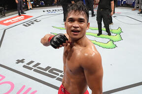 Jeka Saragih of Indonesia reacts after his knockout victory over Pawan Maan of India in their lightweight bout during the Road to UFC event at Singapore Indoor Stadium on June 09, 2022 in Singapore. (Photo by Jeff Bottari/Zuffa LLC)