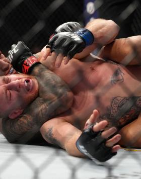 Charles Oliveira of Brazil secures a rear choke submission against Justin Gaethje in the UFC lightweight championship fight during the UFC 274 event at Footprint Center on May 07, 2022 in Phoenix, Arizona. (Photo by Jeff Bottari/Zuffa LLC)