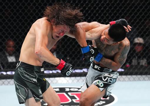 Joshua Van of Myanmar punches Zhalgas Zhumagulov of Kazakstan in their flyweight fight during the UFC Fight Night event at Vystar Veterans Memorial Arena on June 24, 2023 in Jacksonville, Florida. (Photo by Josh Hedges/Zuffa LLC)