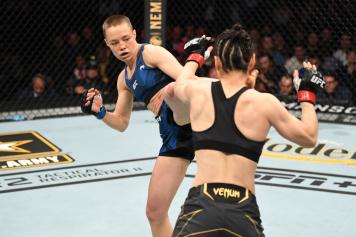 Rose Namajunas kicks Zhang Weili of China in their UFC women's strawweight championship bout during the UFC 261 event at VyStar Veterans Memorial Arena on April 24, 2021 in Jacksonville, Florida. (Photo by Josh Hedges/Zuffa LLC)