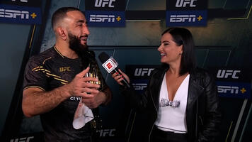 Welterweight Champion Belal Muhammad Reacts With Megan Olivi After His Title Winning Performance Against Leon Edwards At UFC 304 In Manchester On July 27, 2024