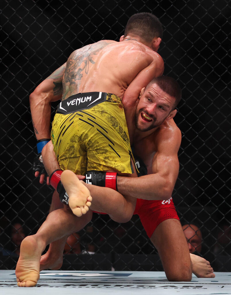 Mateusz Gamrot of Poland fights Rafael Dos Anjos of Brazil during their lightweight bout at UFC 299 at Kaseya Center on March 09, 2024 in Miami, Florida. (Photo by Megan Briggs/Getty Images)