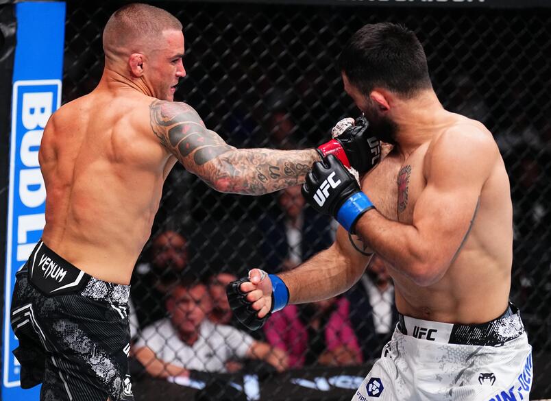 Dustin Poirier punches Benoit Saint Denis of France in a lightweight fight during the UFC 299 event at Kaseya Center on March 09, 2024 in Miami, Florida. (Photo by Chris Unger/Zuffa LLC via Getty Images)