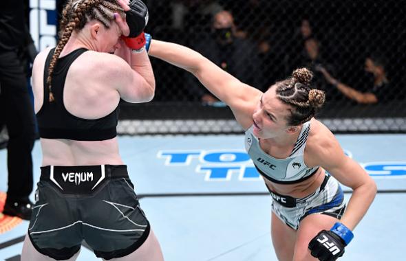 Vanessa Demopoulos punches JJ Aldrich in a flyweight fight during the UFC Fight Night event at UFC APEX on August 28, 2021 in Las Vegas, Nevada. (Photo by Chris Unger/Zuffa LLC)