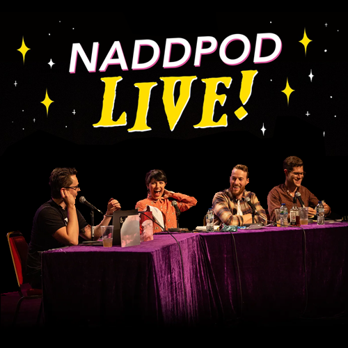 The crew of Not Another D&D Podcast performing on stage, "NaddPod Llive" above their heads