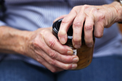 arthrtitic-hand-and-jar_iStock