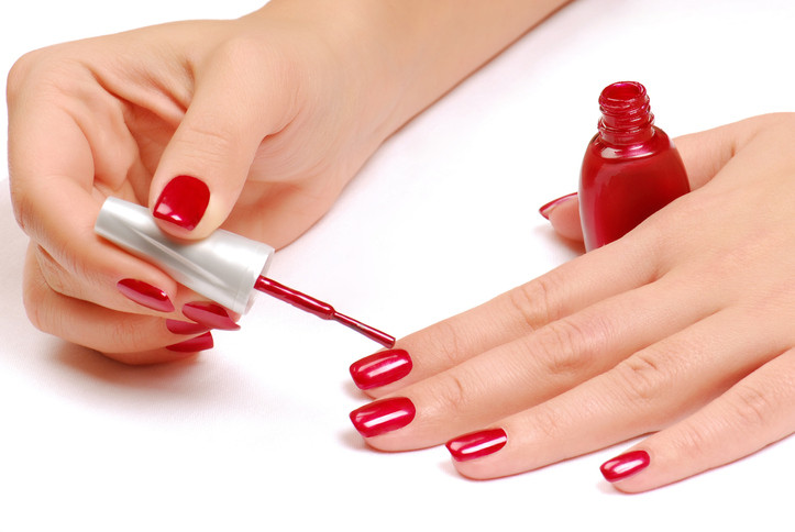 woman-applying-nail-polish