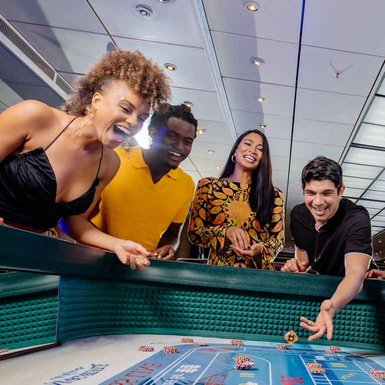 A Group Of People Playing A Board Game