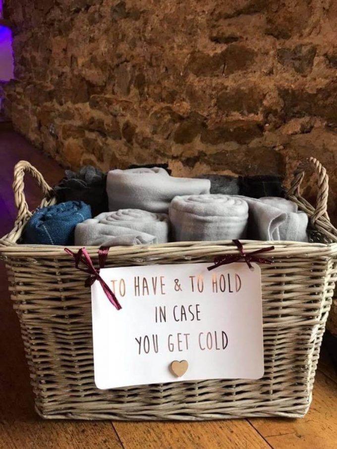 rustic sign for towel favor basket at wedding