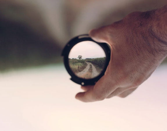 Person Holding Lens Focus