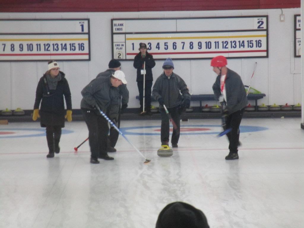 David Lee wearing his eSight while curling.