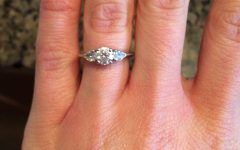 Round Brilliant Engagement Rings with Pear-shaped Side Stones