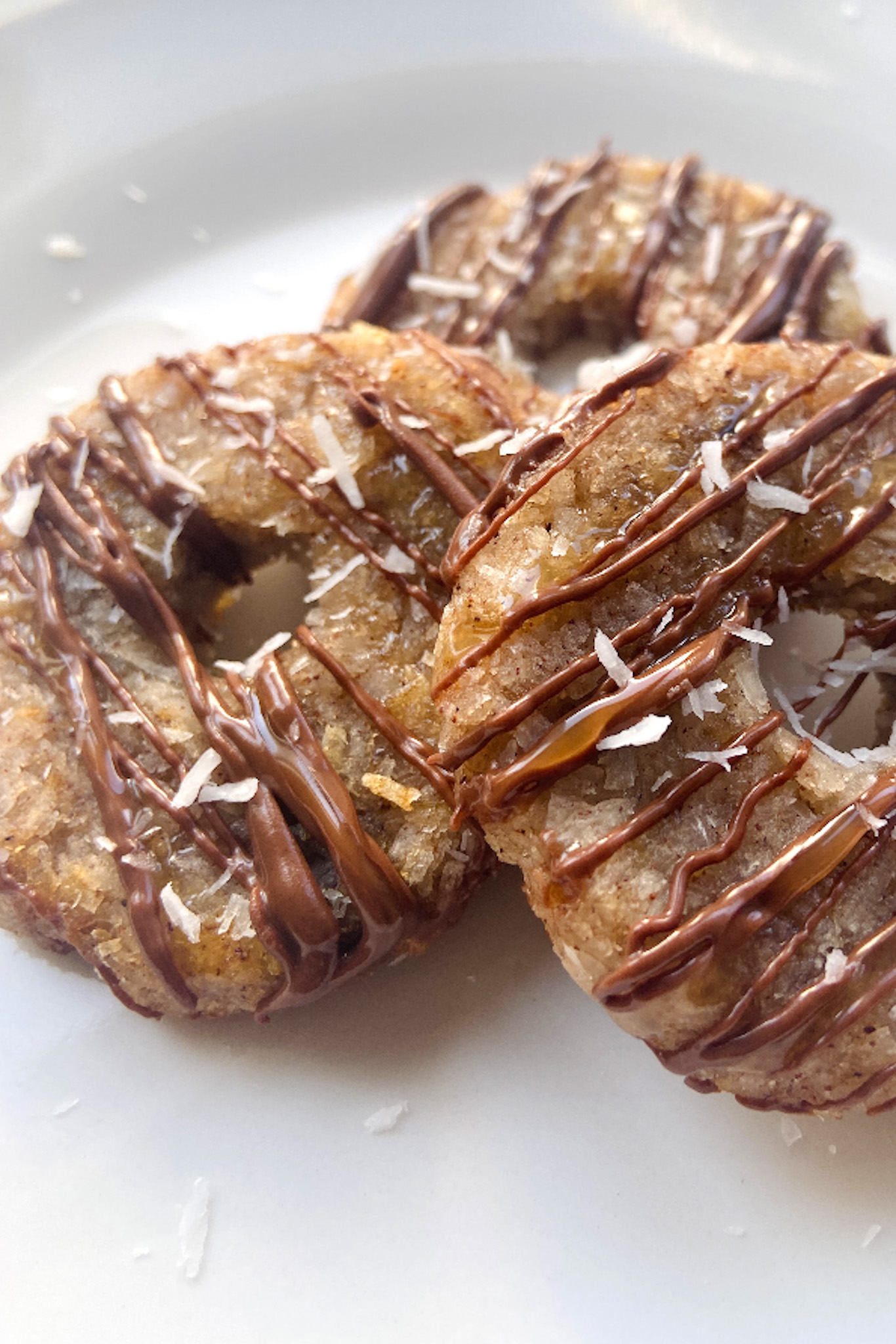 Coconut cookies drizzled with chocolate and caramel sauce