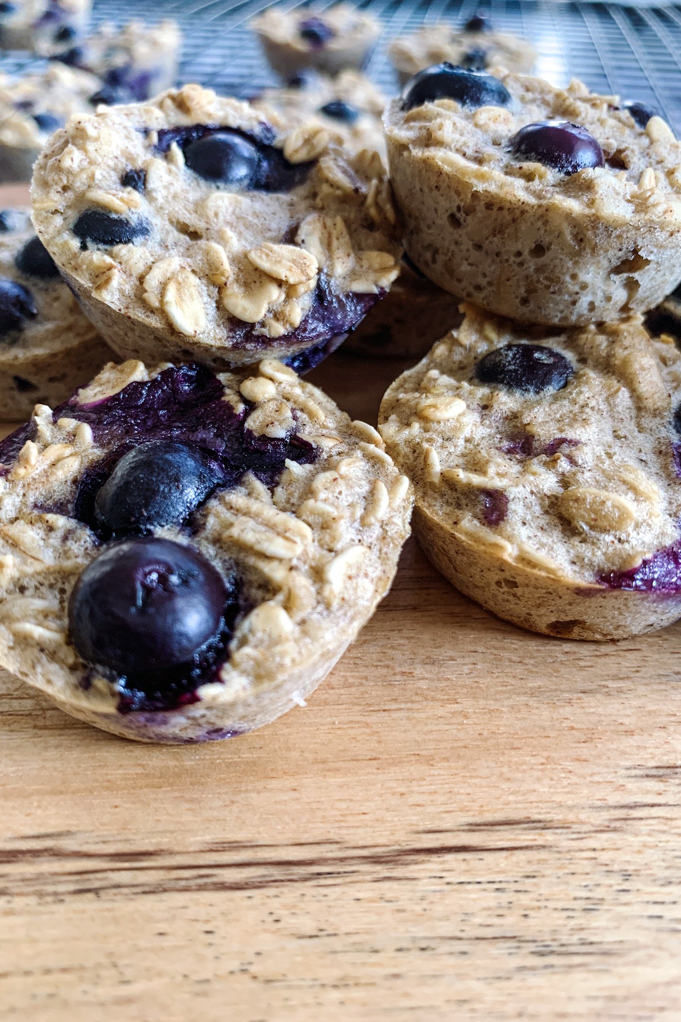 Berry oatmeal bites served on a wooden cutting board