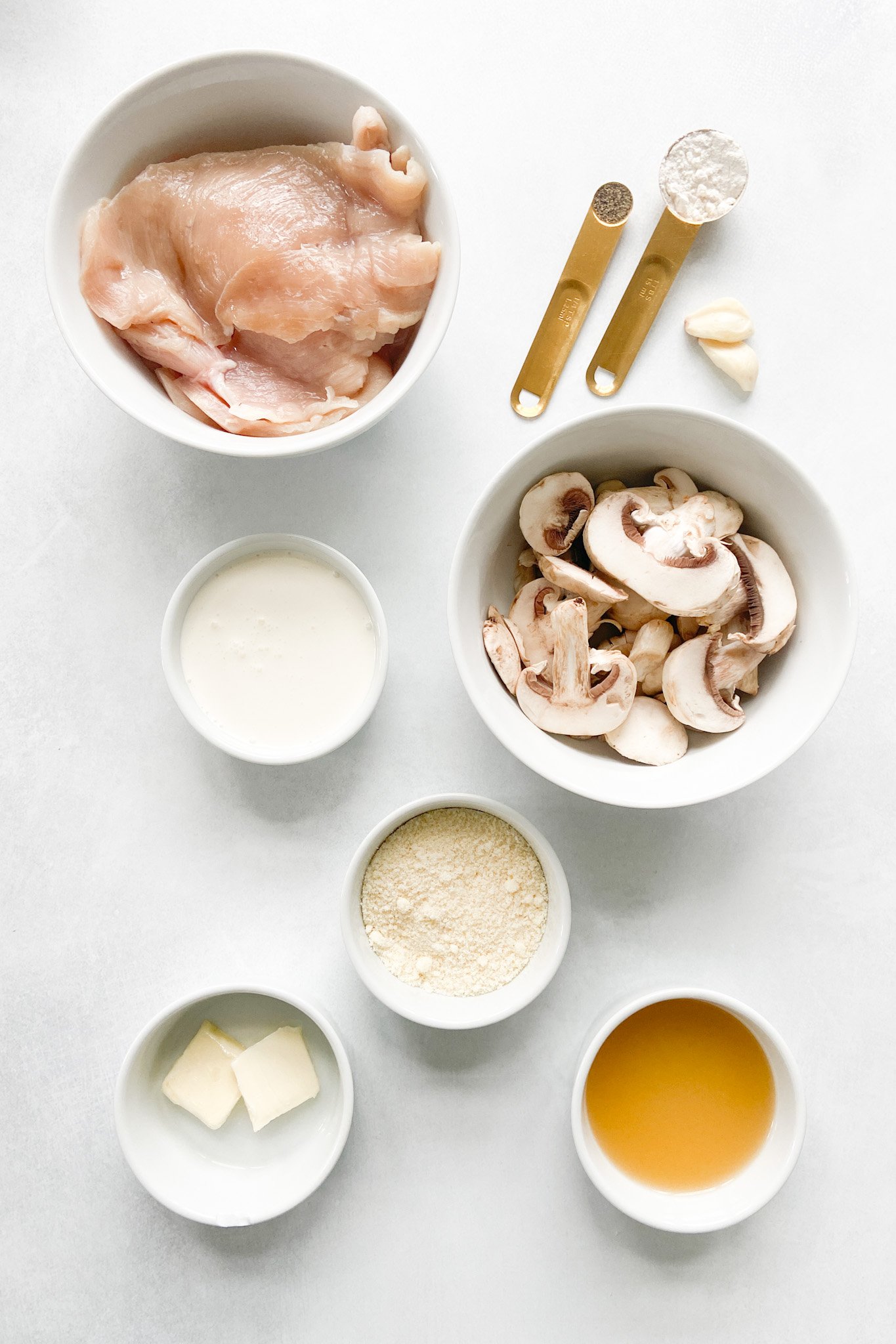 Ingredients to make creamy mushroom chicken. See recipe card for detailed ingredient quantities.
