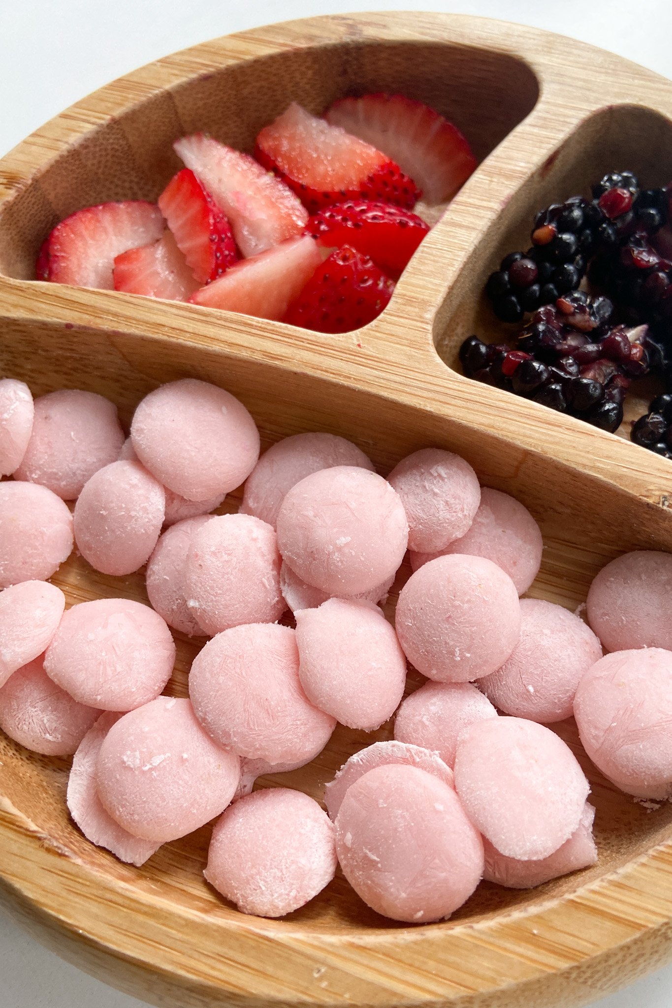 Strawberry banana yogurt melts served with sliced strawberries and blackberries