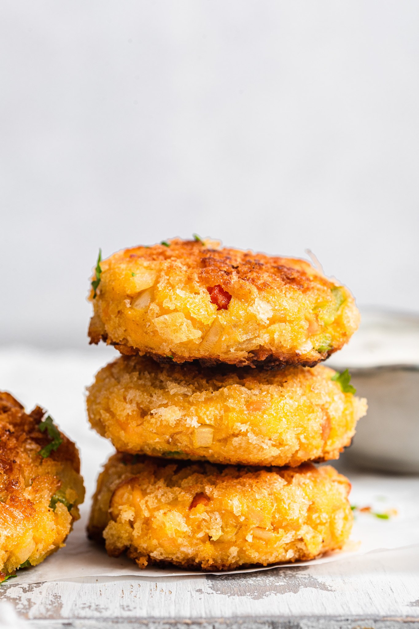 Salmon cakes stacked one on top of the other