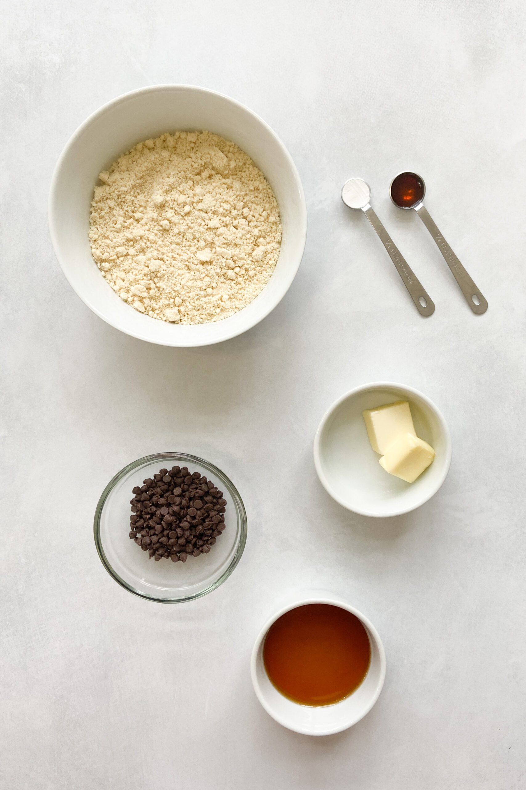 Ingredients to make chocolate chip almond cookies.