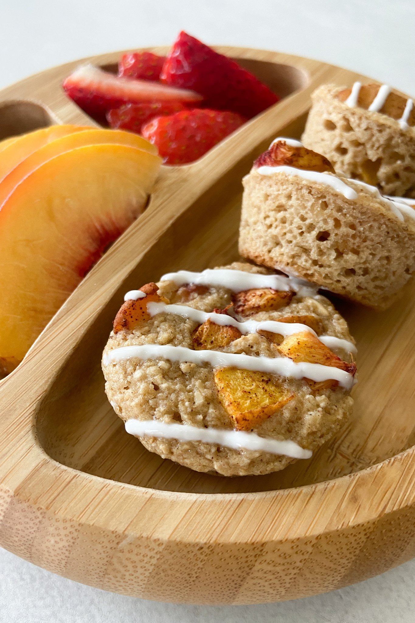 Peach cobbler muffins served with fruits.