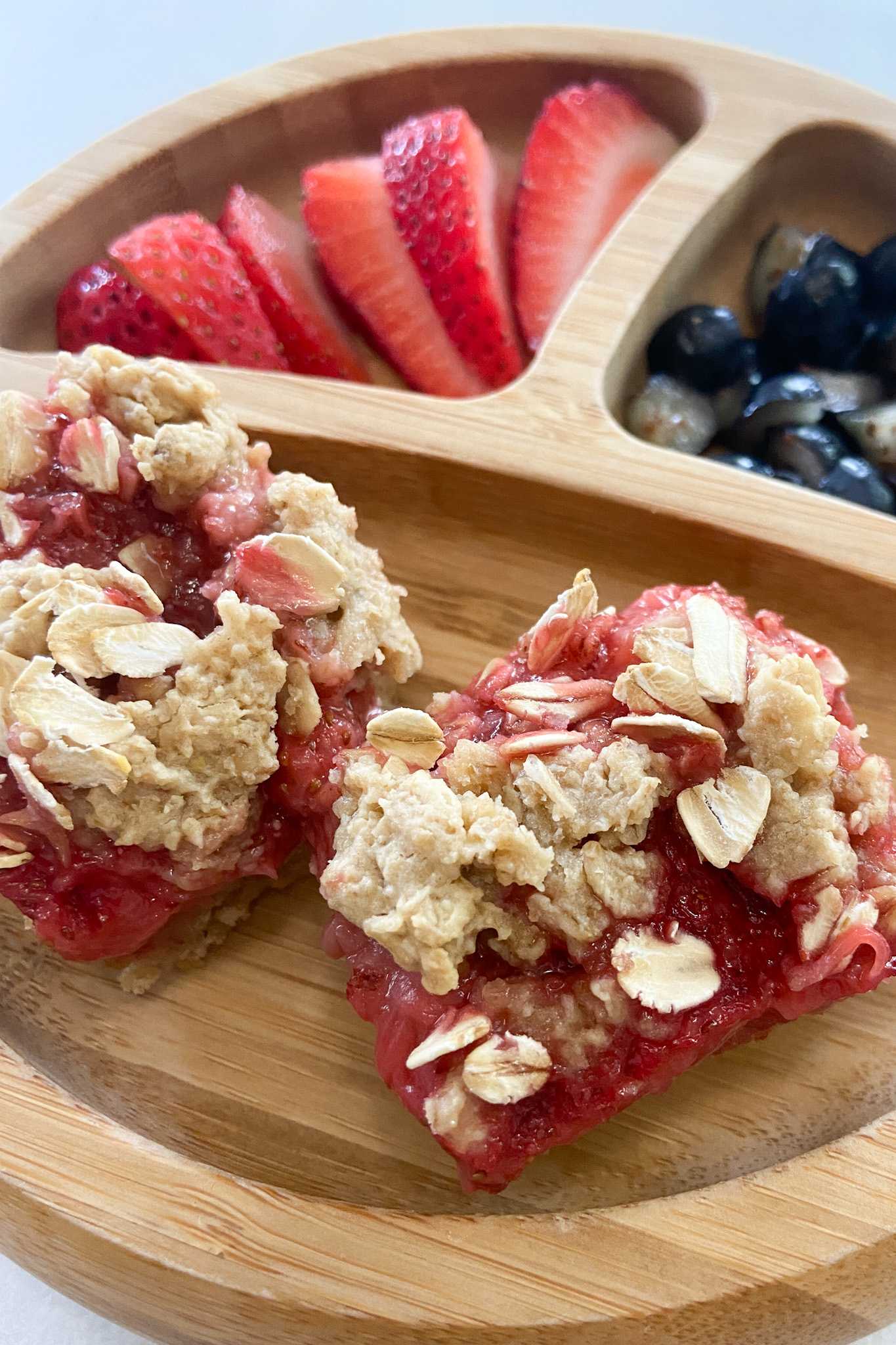 Strawberry crumble bars served with fruits