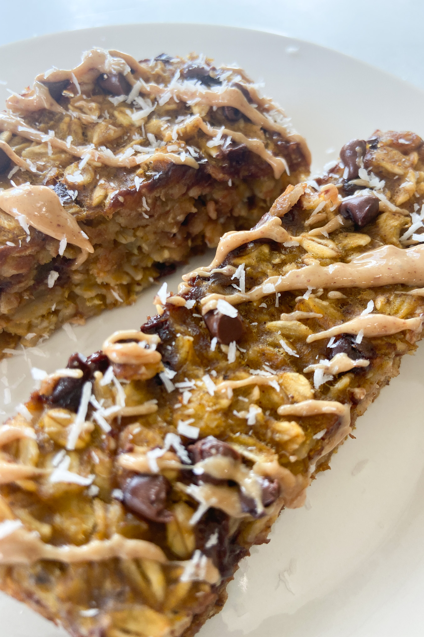 Pumpkin oat bars topped with shredded coconut.