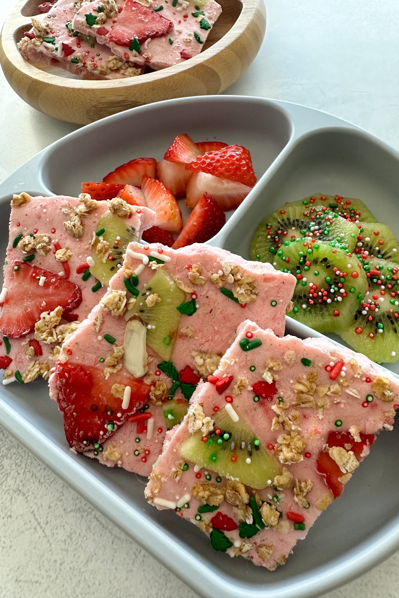 Strawberry yogurt bark served with fresh fruits.