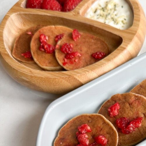 Peanut butter banana pancakes served with raspberries and bananas.