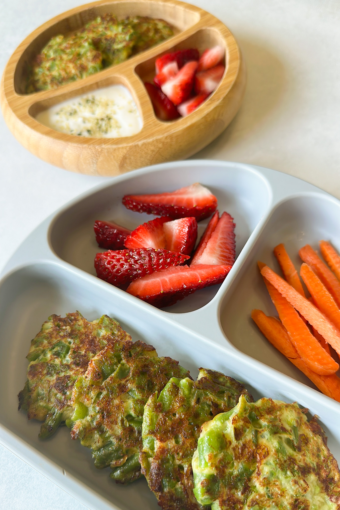 Green bean fritters served with strawberries and carrots.