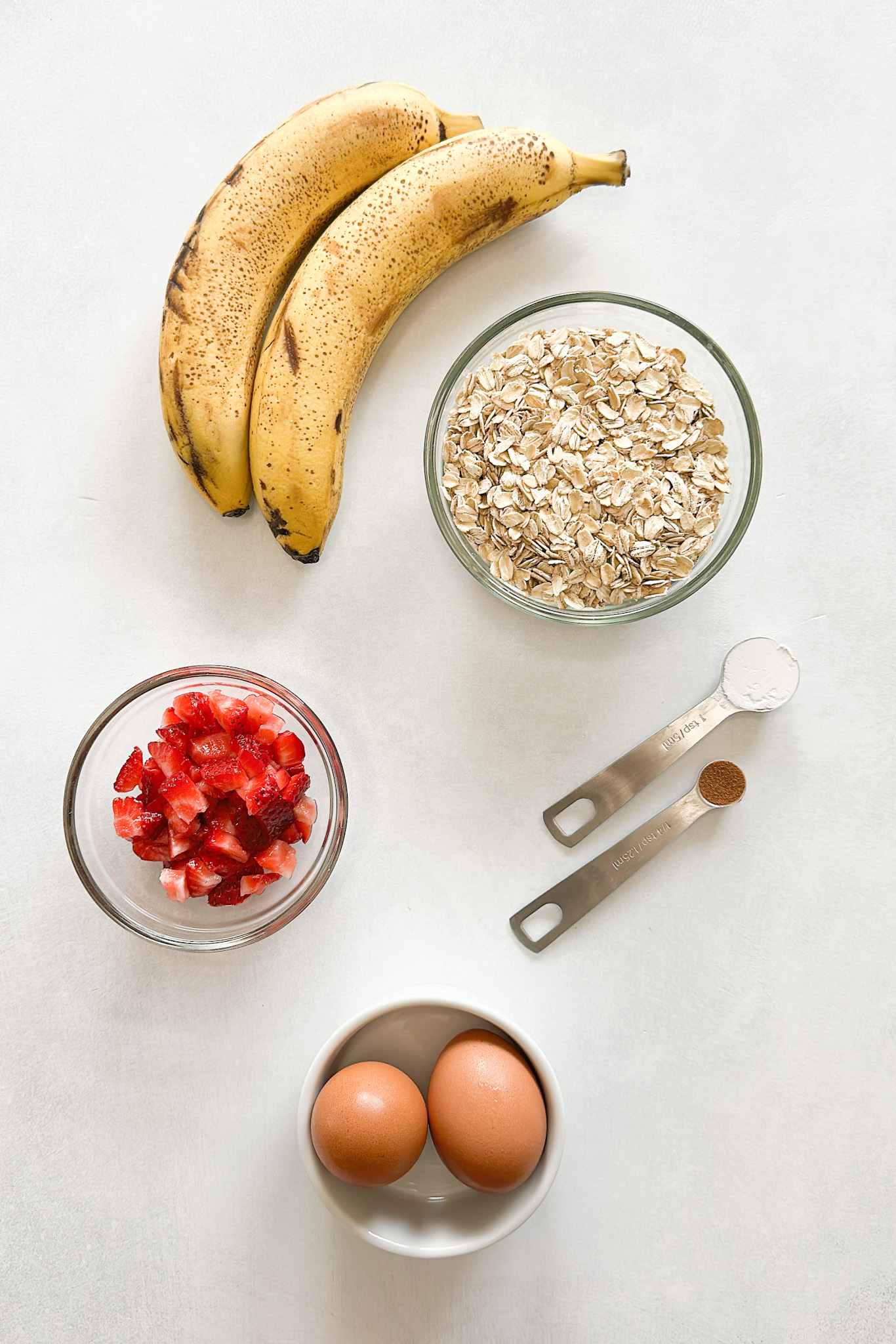 Ingredients to make strawberry banana oatmeal muffins.