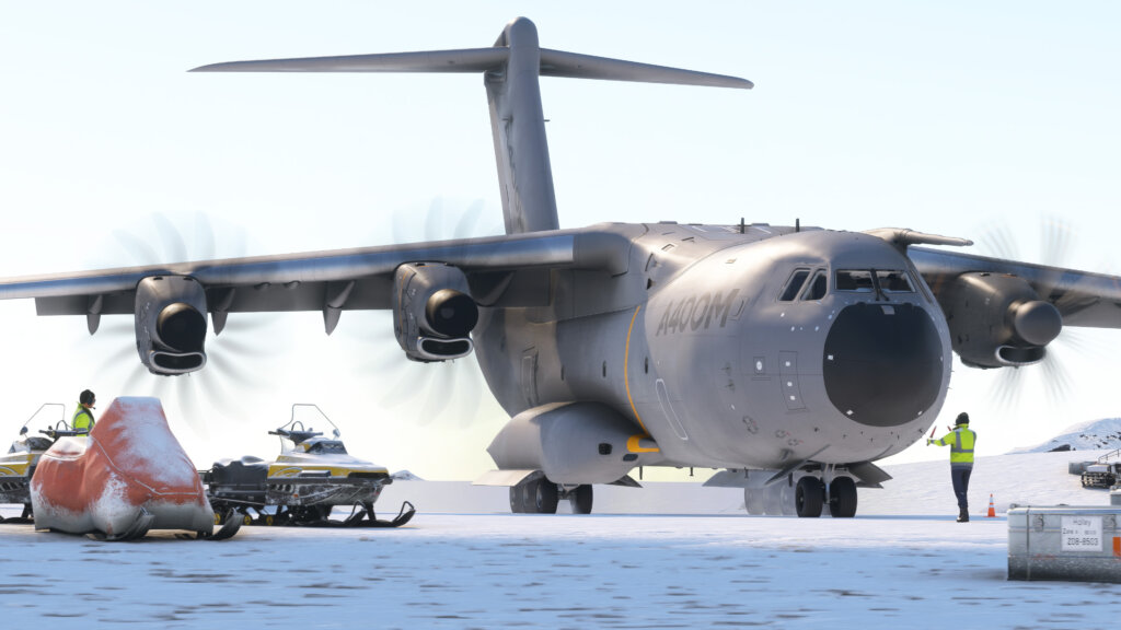 An Airbus A400M cargo plane taxis across snowy terrain